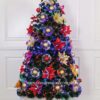 Multihued Brilliance Christmas Tree with Poinsettia Accents.